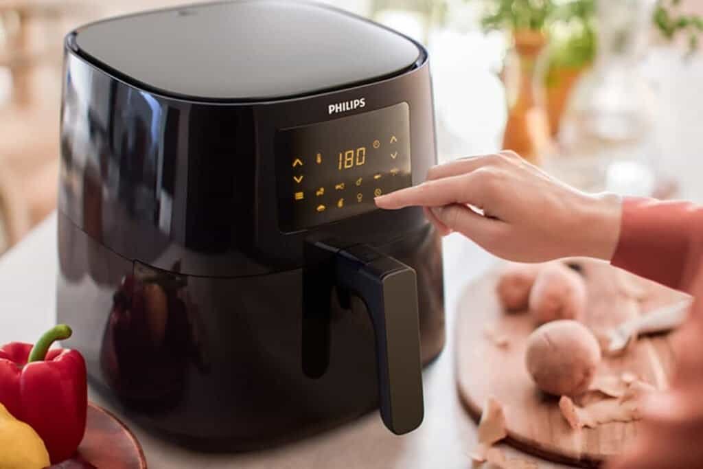 Modern Philips air fryer with digital controls for healthy frying and cooking.